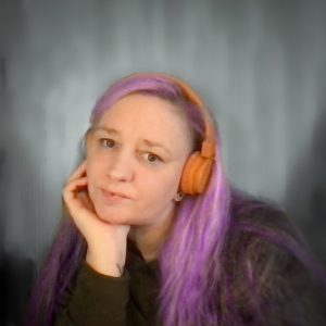 profile photo, me with purple hair and orange headphones